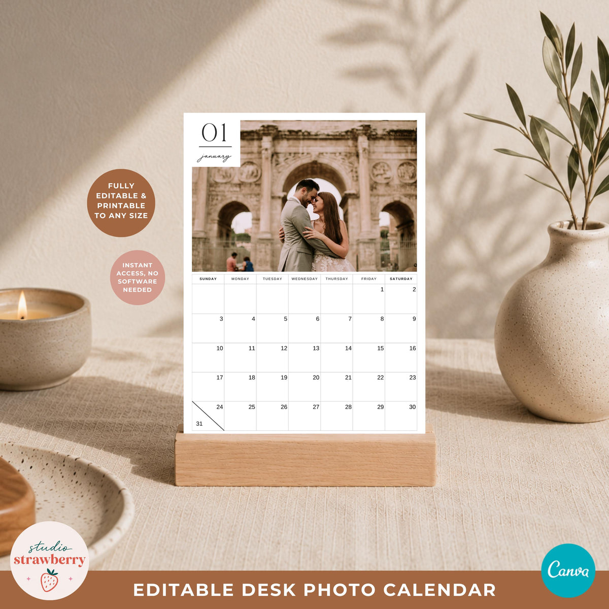 Warm neutral desk mockup showing a 2027 photo calendar template in a wooden stand with a large photo area and monthly grid.