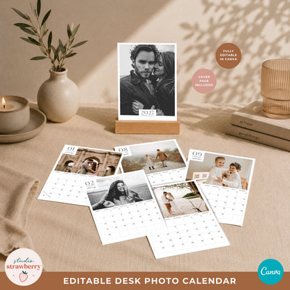 Personalized photo calendar template cover in a wooden stand with several monthly photo calendar pages arranged in front.
